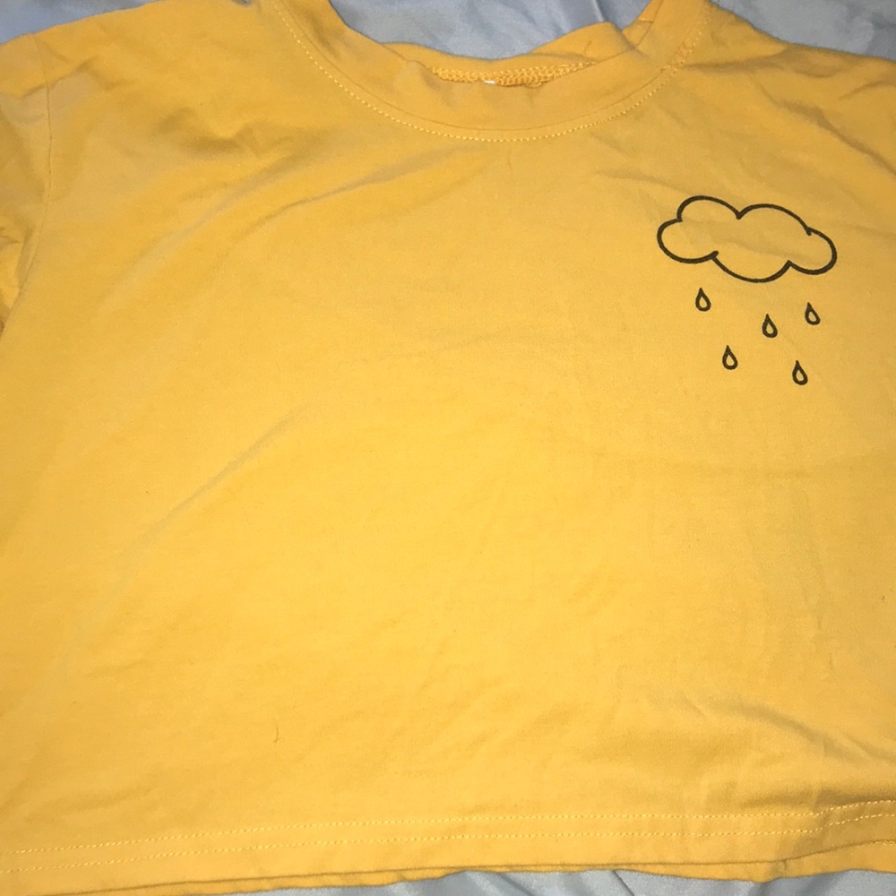 yellow cropped top with rain cloud in the corner